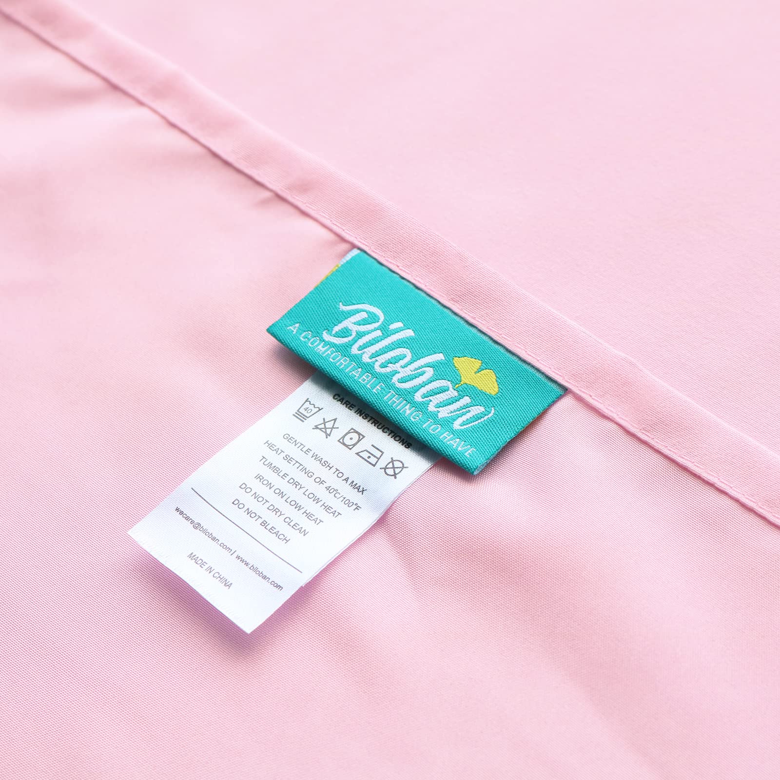 Biloban pink cot sheet packaging ready for immediate use in daycare settings.