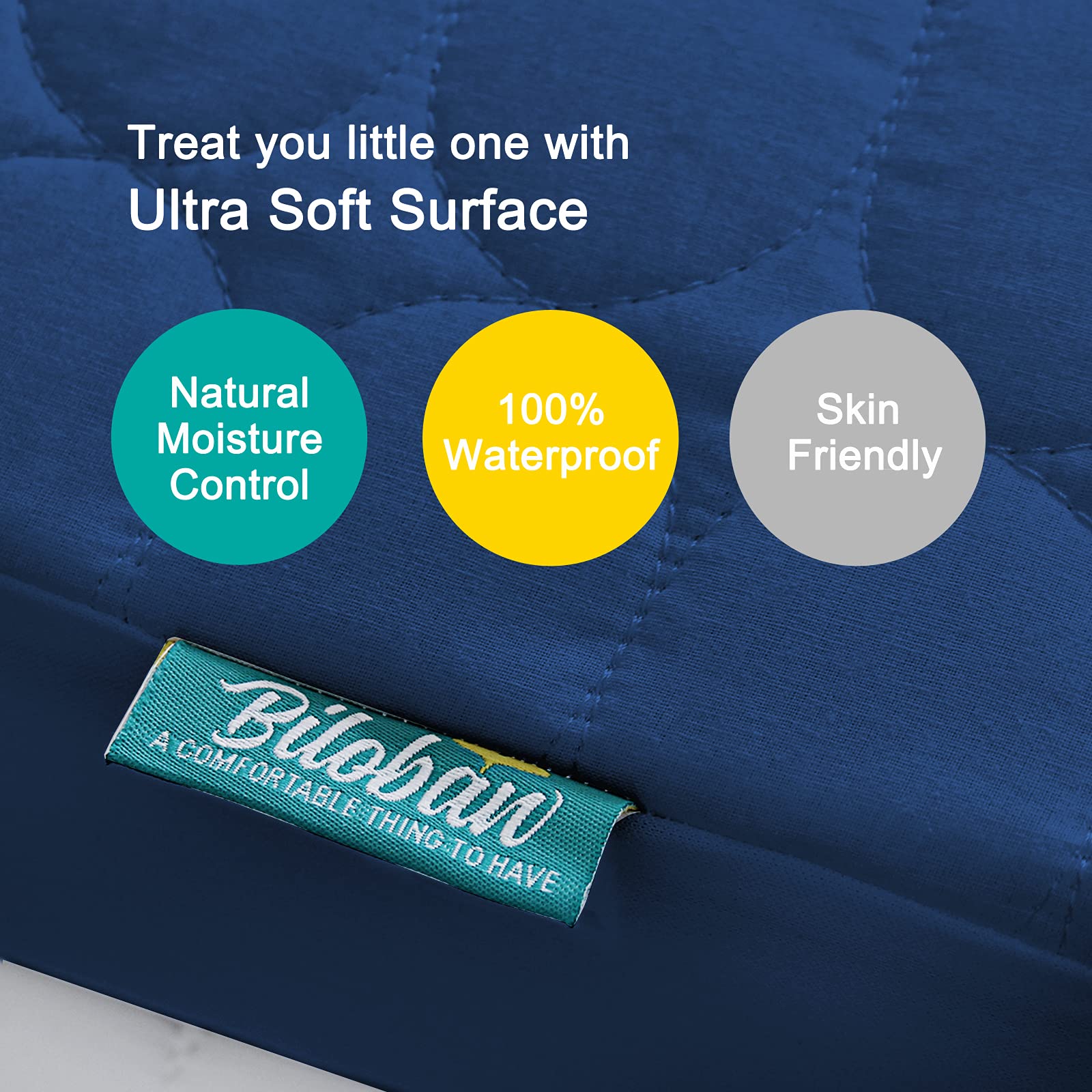Biloban crib mattress pad with soft top layer providing a gentle sleep surface