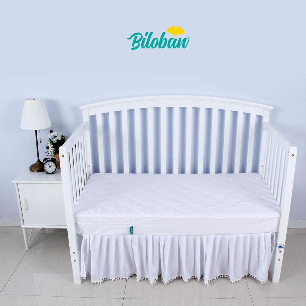 Biloban crib mattress protector with soft padding for extra baby comfort.