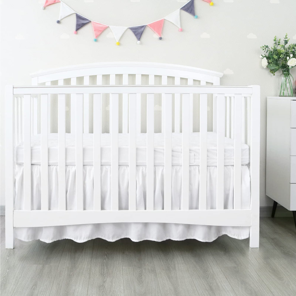 Machine washable Biloban crib skirt for easy care and freshness.