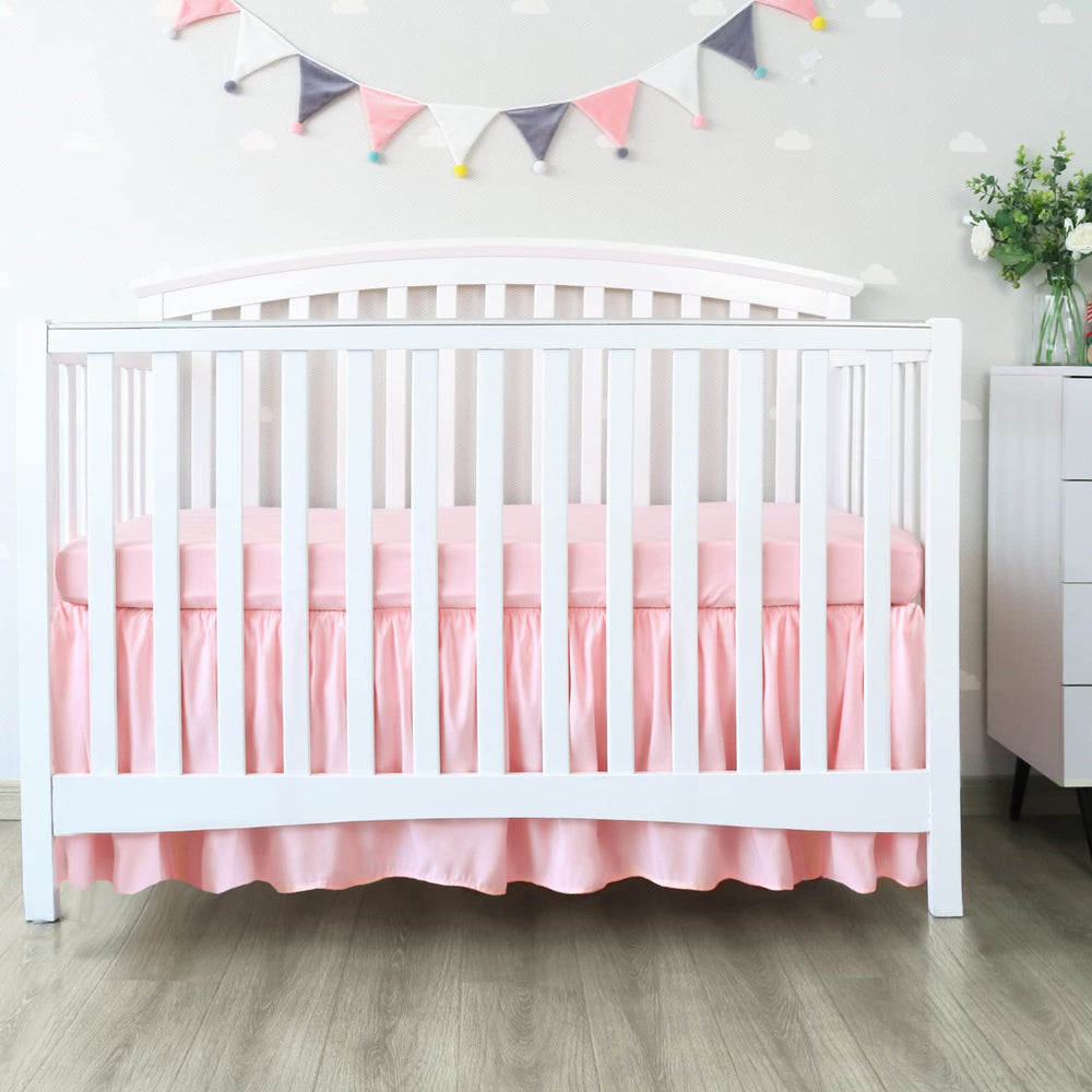 Biloban pink pleated dust-ruffle secures four sides for stable fit.