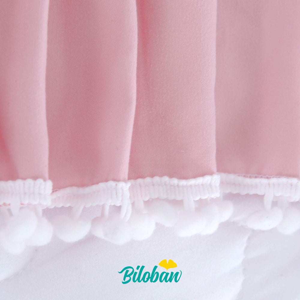 Biloban pink dust-ruffled crib skirt adds soft, polished nursery look