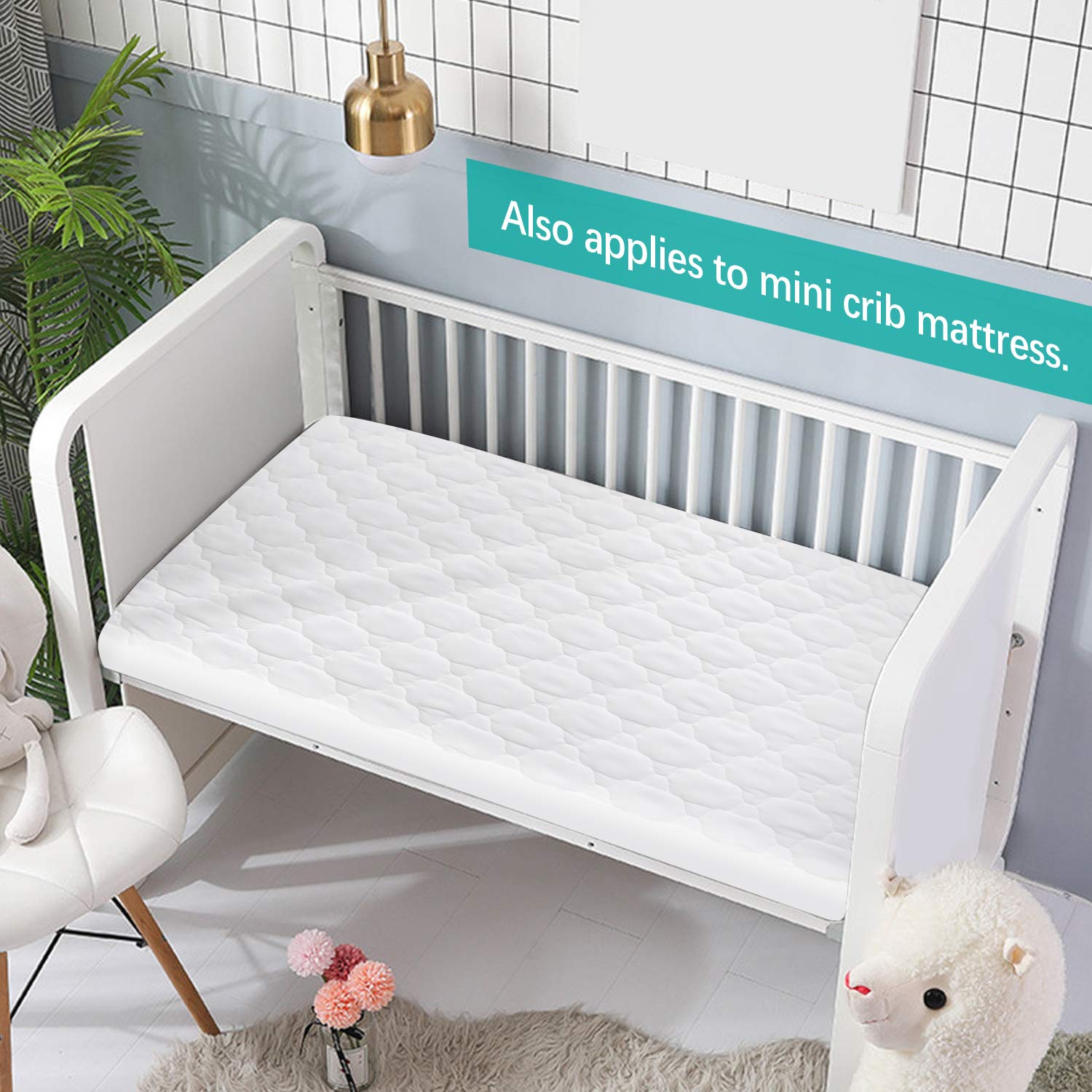Biloban fitted-sheet style protector with elastic skirt secures mini playard mattresses