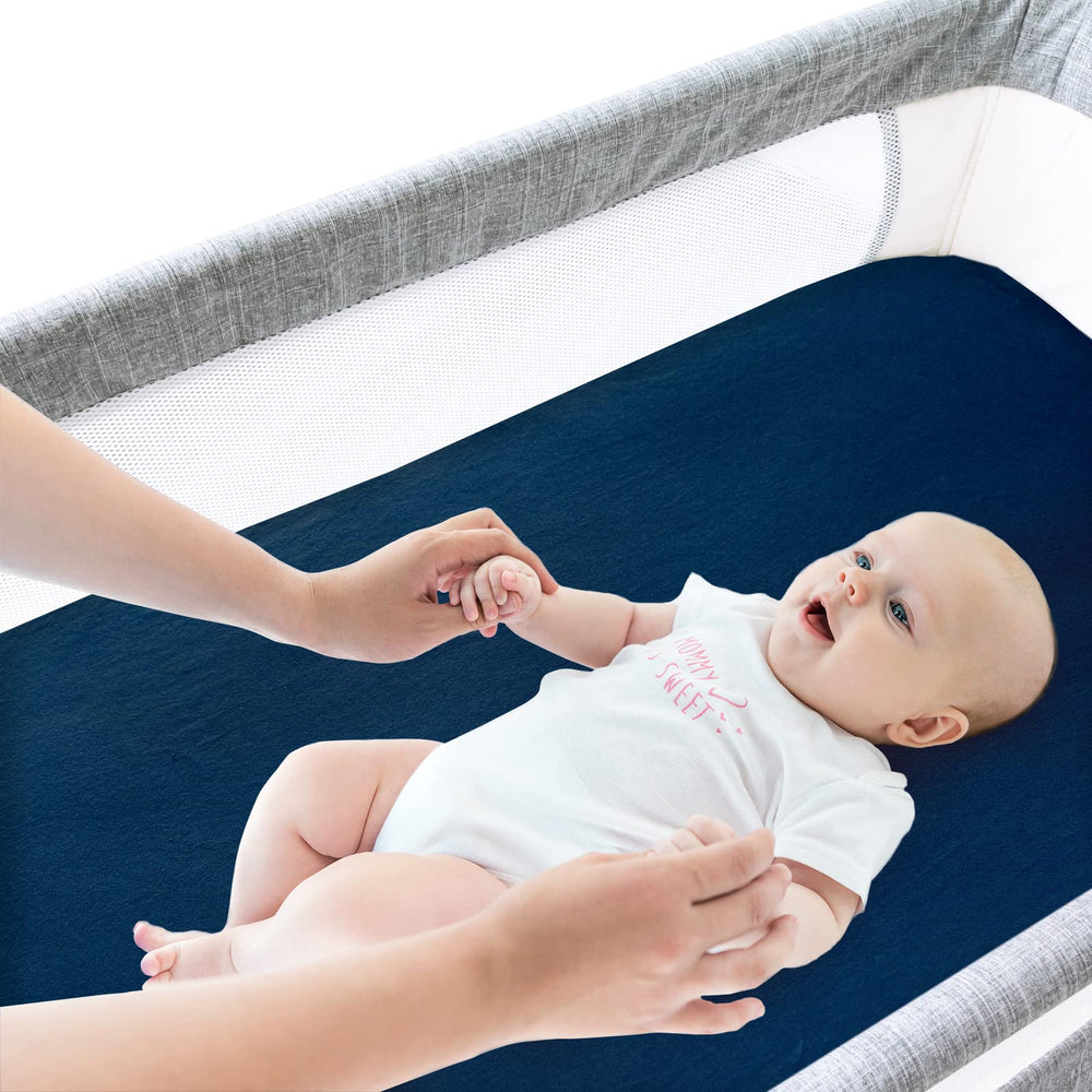 Gray and navy Biloban bassinet sheets add calm style