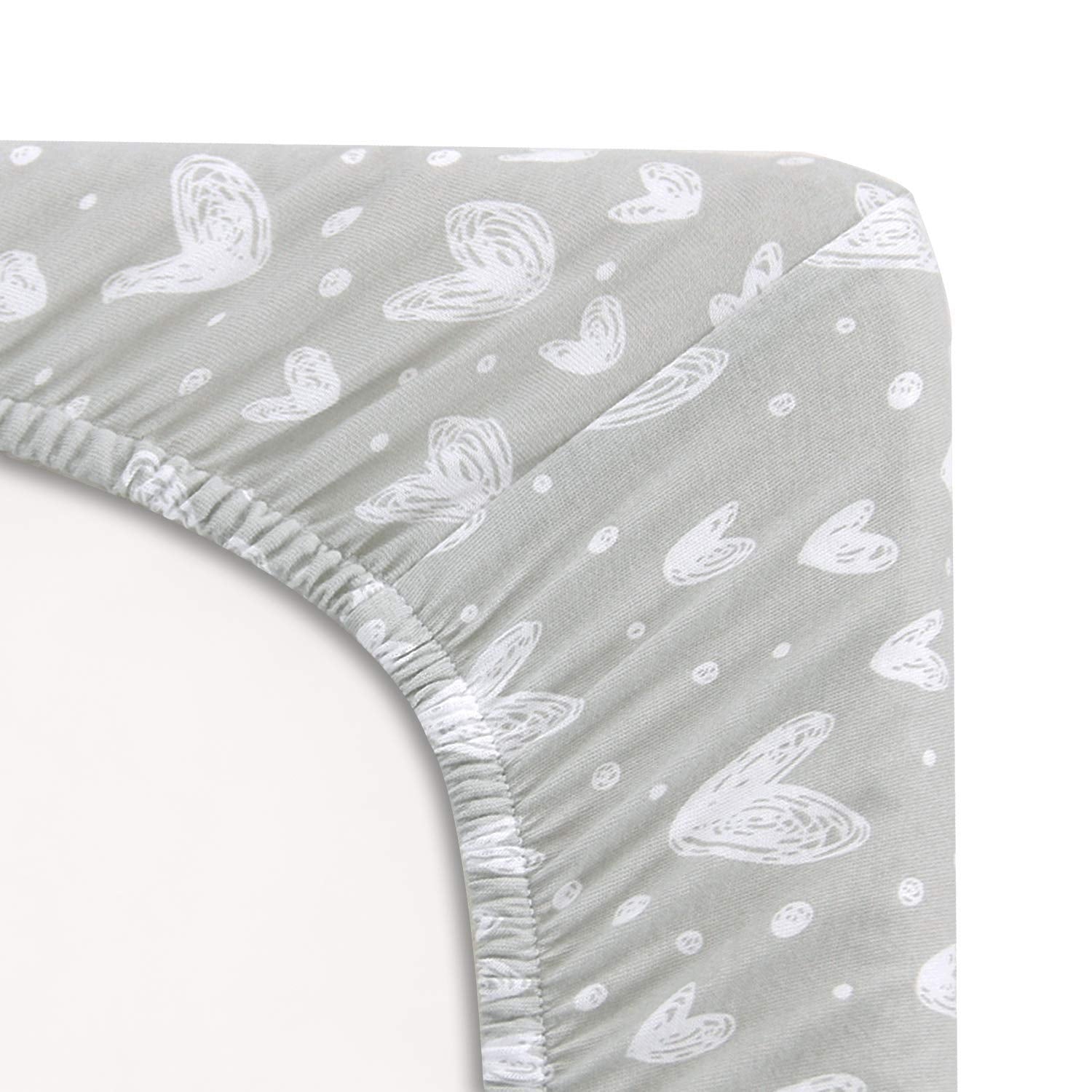 Two-pack jersey cotton fitted sheets stay snug on a playard mattress.