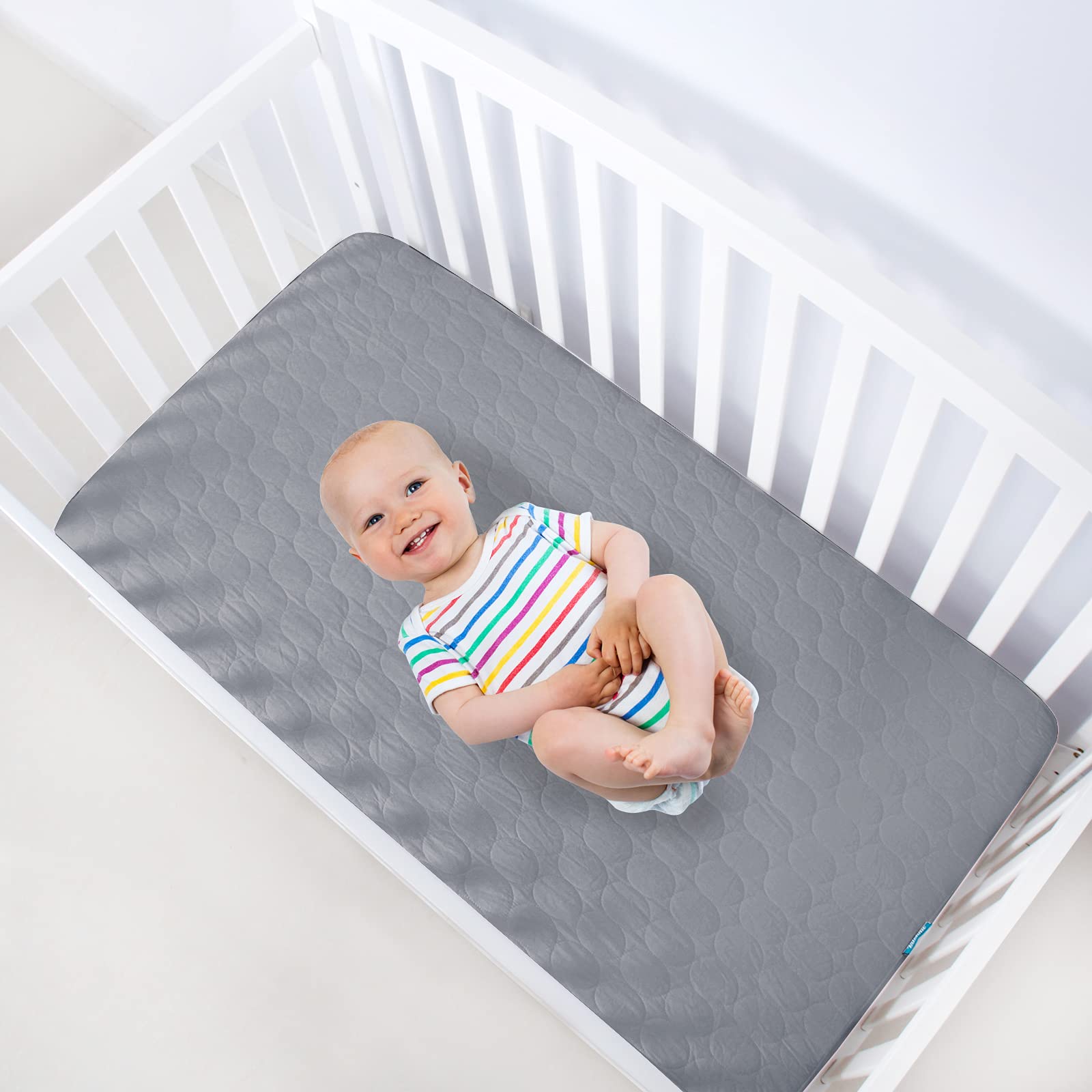 Biloban machine-washable crib mattress pad cleans easily after leaks.