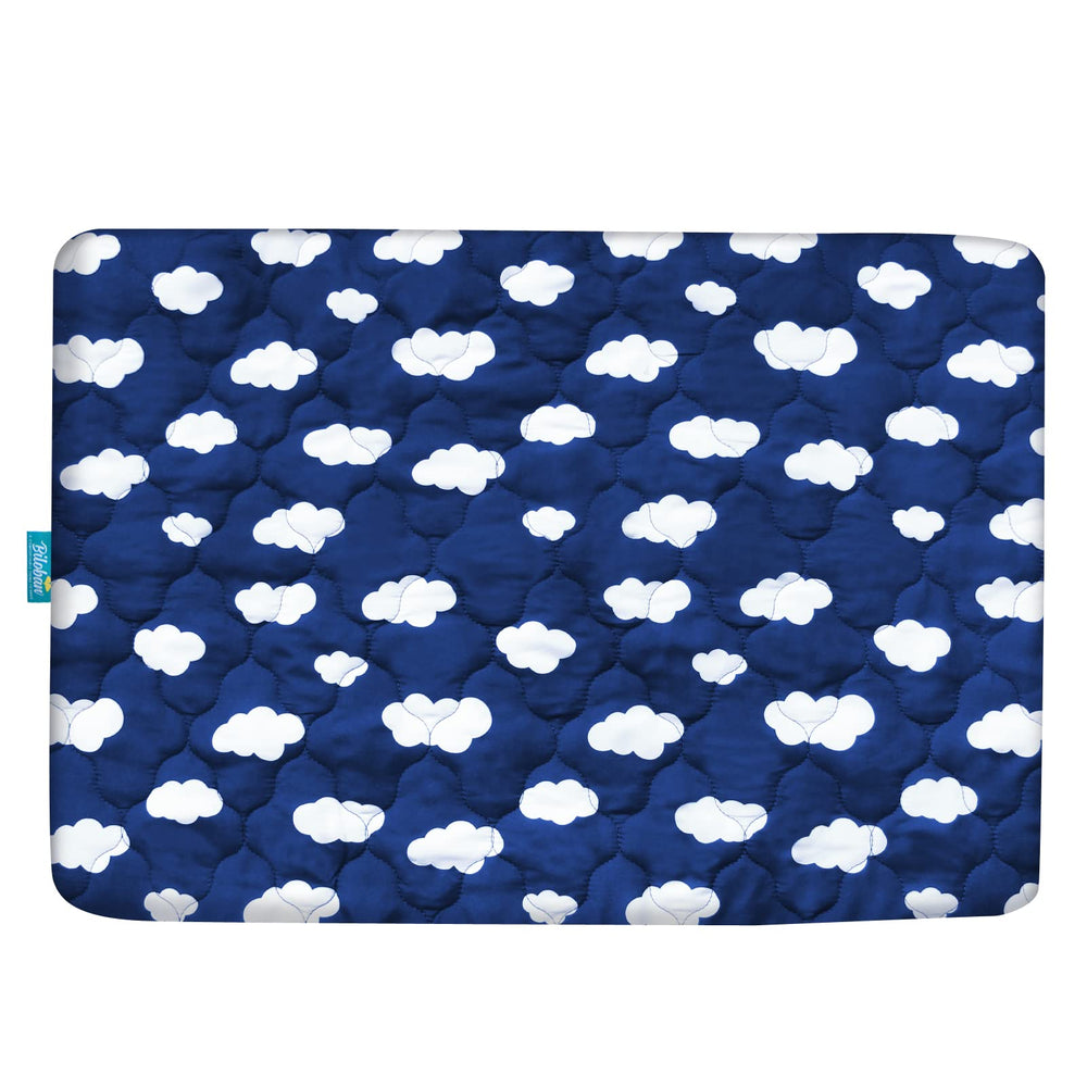 Mini crib protector sized 39 by 27 inches in navy cloud design.