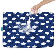 Biloban Pack and Play protector with navy cloud cover protects against spills.