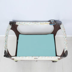 Biloban elastic-edge fitted sheet on a Graco playard for a flat sleep surface