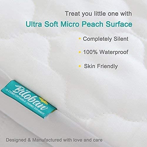 White Biloban playard cover adds clean, nursery-friendly look.