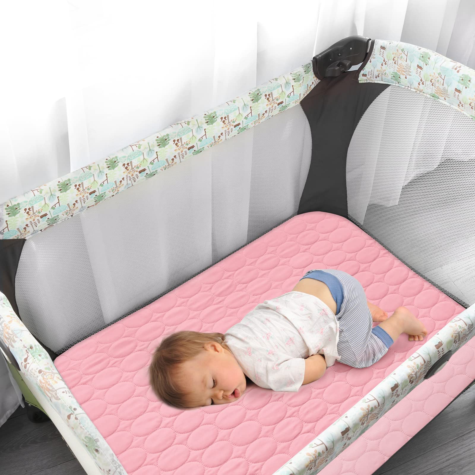 Biloban quilted microfiber mattress pad closeup offers plush comfort for peaceful baby sleep.
