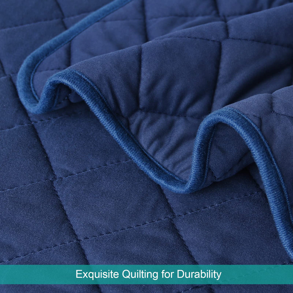 Biloban navy quilted design delivers durable, cozy texture for naps and cuddles.