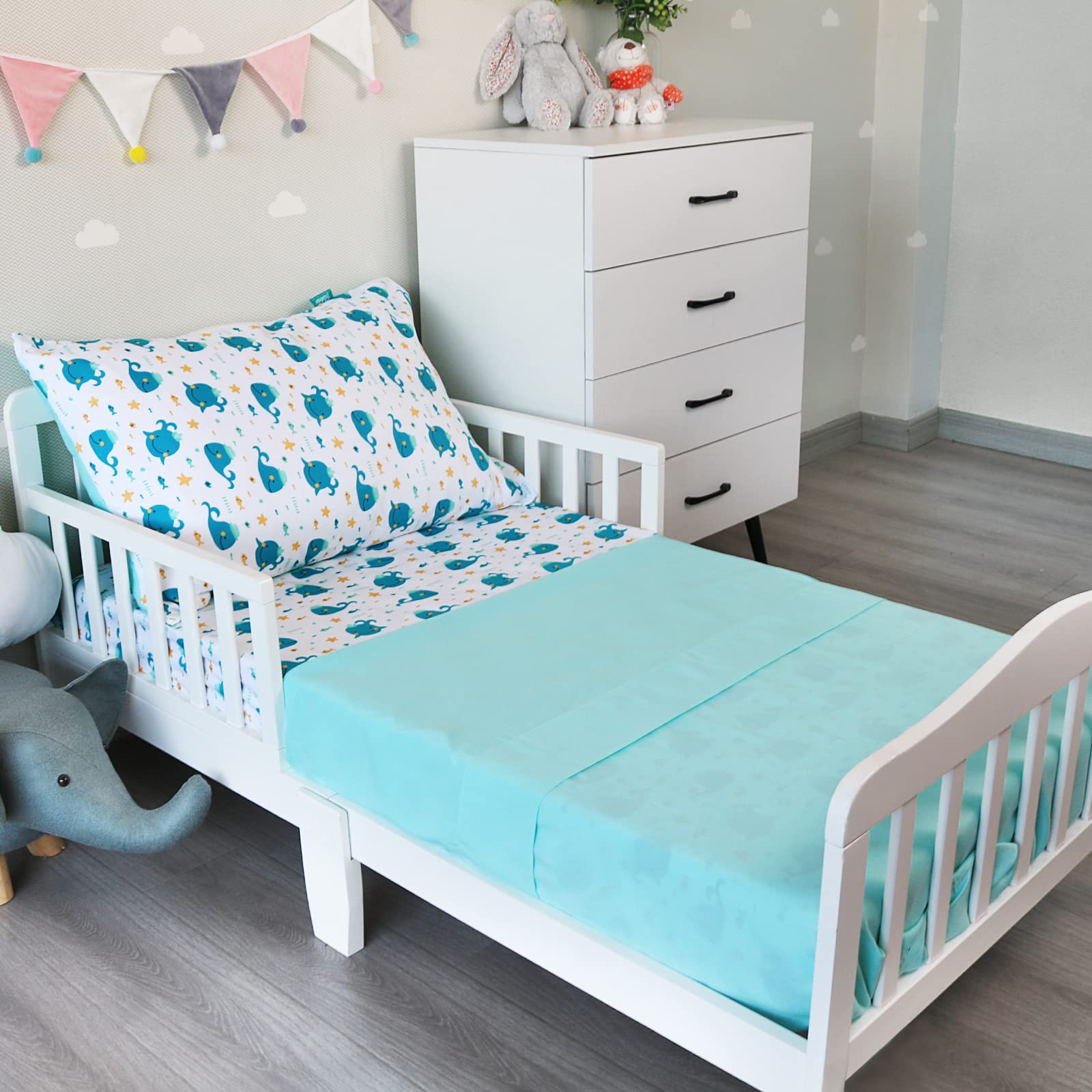 Biloban Whale toddler sheet set fabric closeup highlights silky microfiber for gentle sleep.