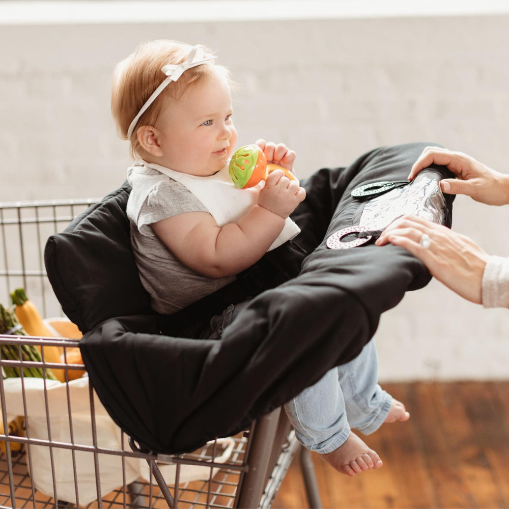 Binxy Baby padded cart-seat cover keeps little one comfy on aisles