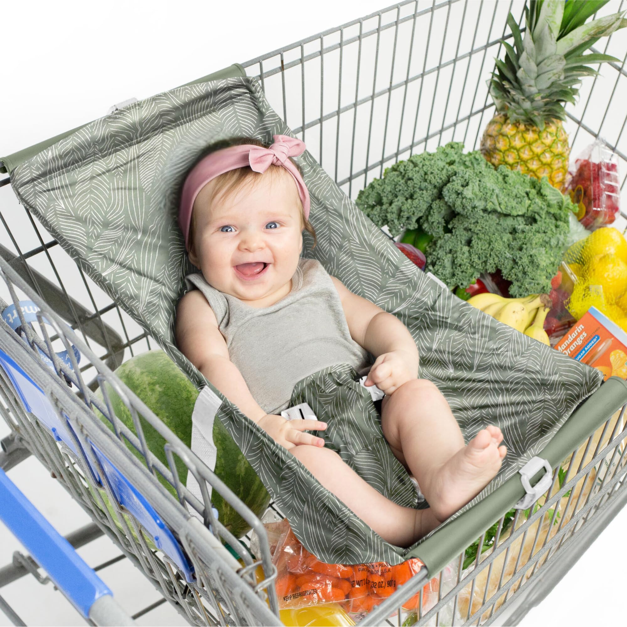 Binxy Baby shopping cart hammock attached to a standard grocery cart for hands-free shopping.