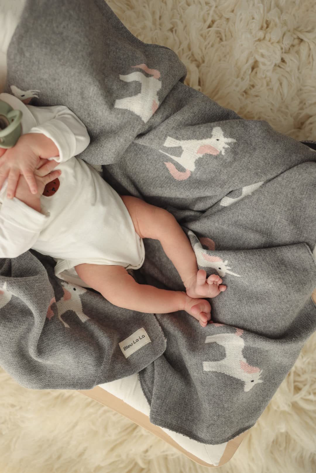 Bleu La La baby blanket in stroller setting ready for on-the-go comfort.