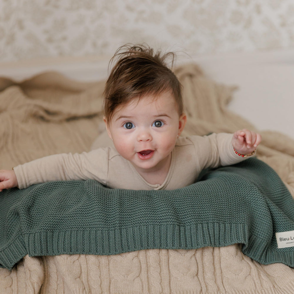 36x32 inch Bleu La La blanket enables wrapping and cuddling for growing babies.