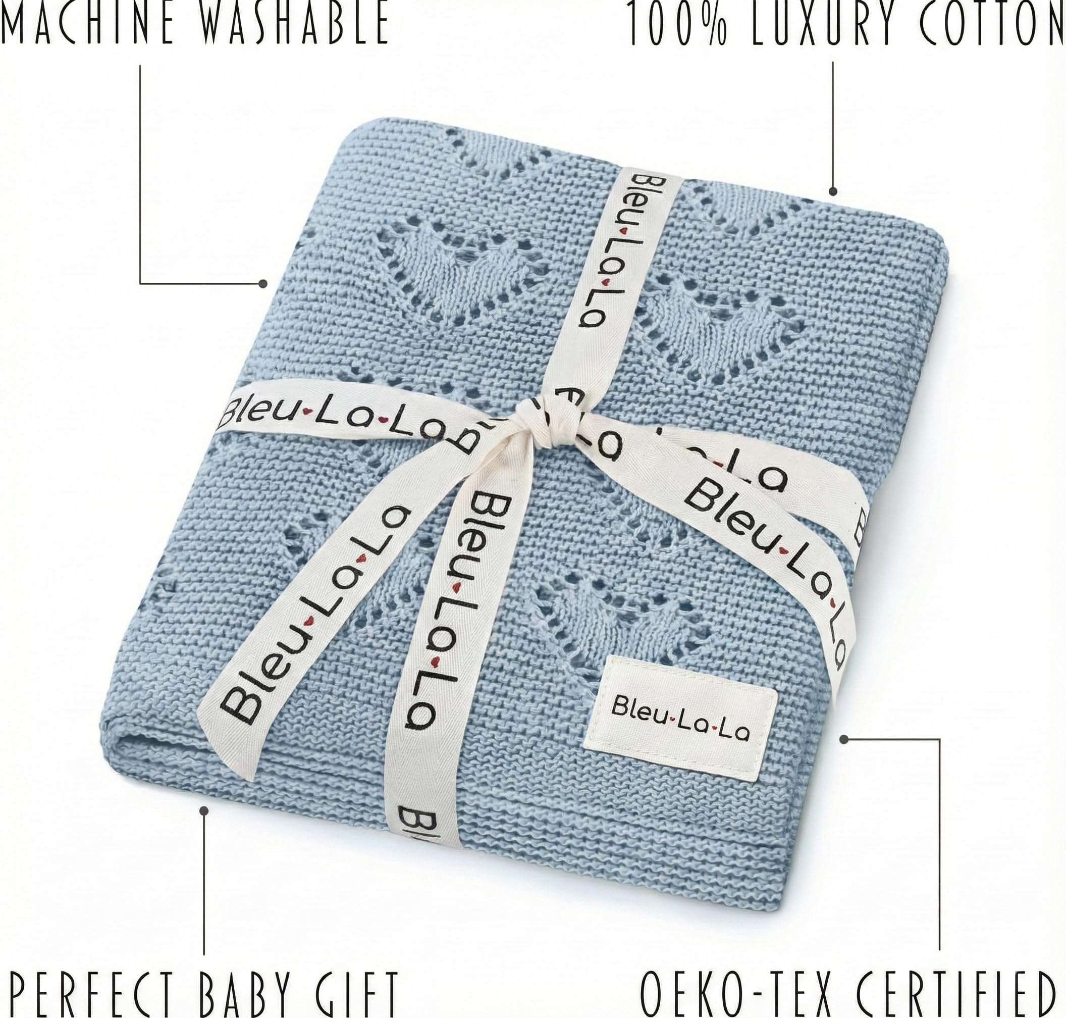 Newborn swaddling with Bleu La La Heirloom Heart Knit blanket for gentle warmth.