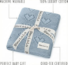 Newborn swaddling with Bleu La La Heirloom Heart Knit blanket for gentle warmth.
