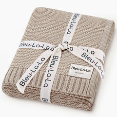 Bleu La La Heritage Knit organic cotton baby blanket in oatmeal; soft, breathable weave for delicate skin.