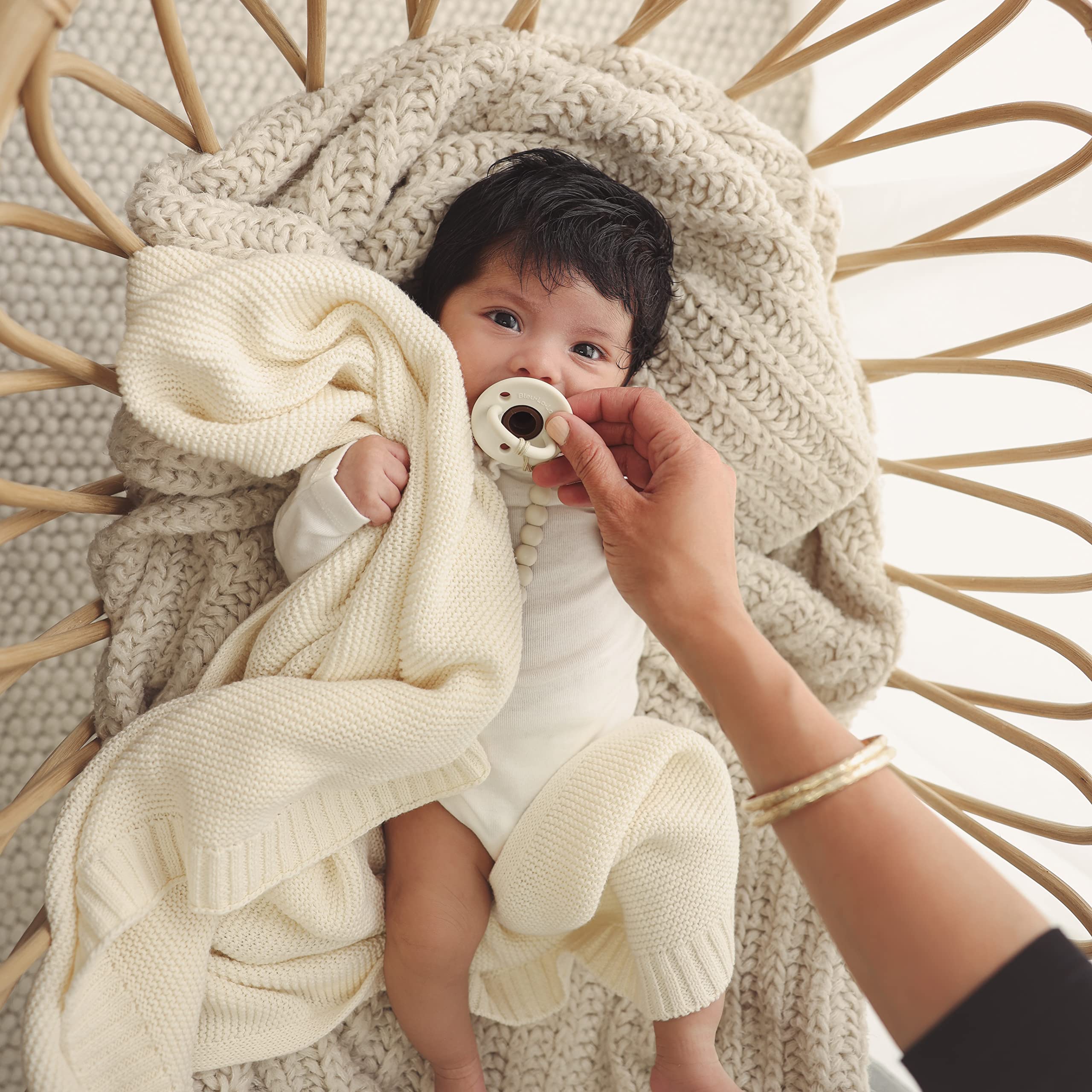 Denim blue swaddle used as stroller cover for a breezy day out