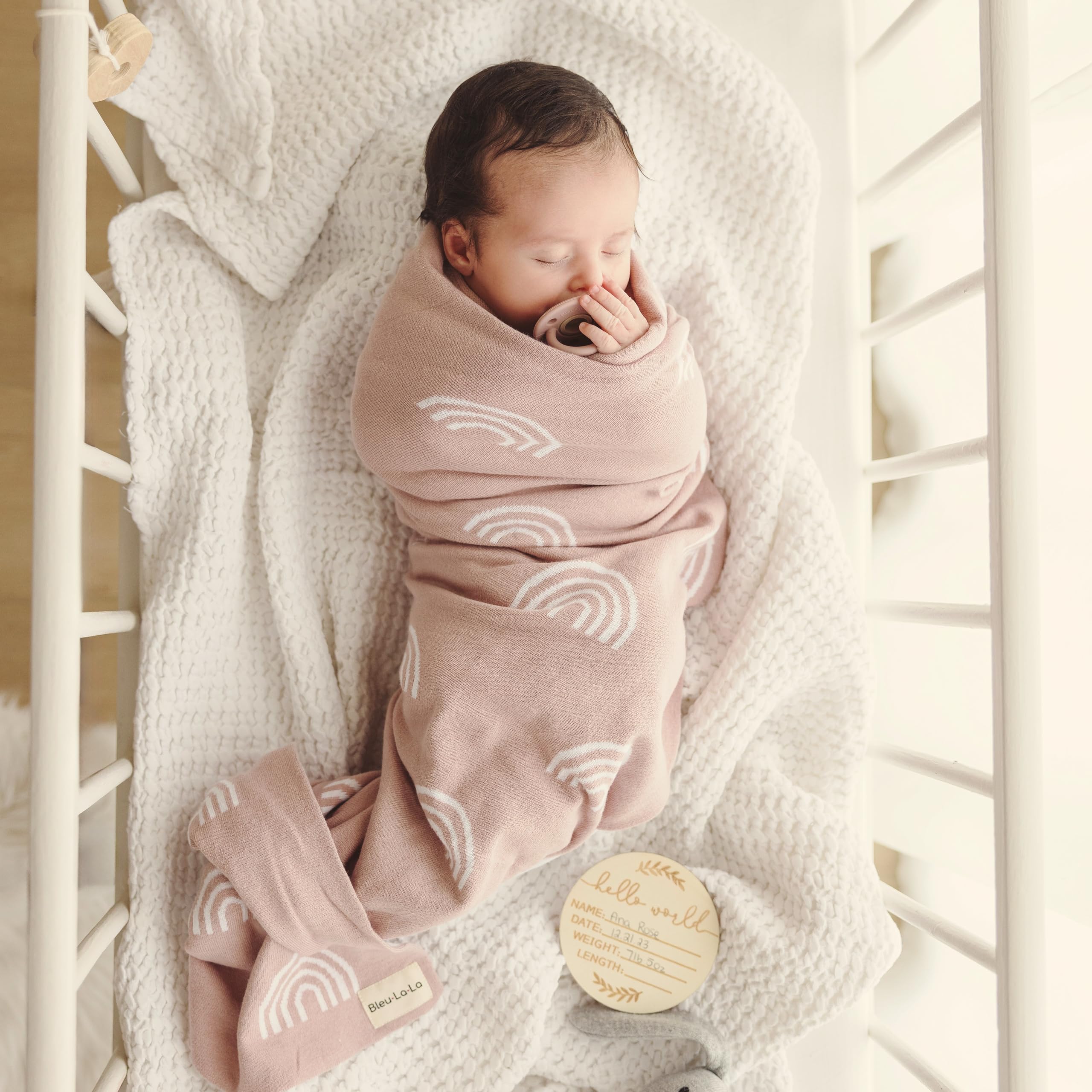 Bleu La La Knit Baby Swaddle Rainbow Pink on stroller shows portability for on-the-go use.