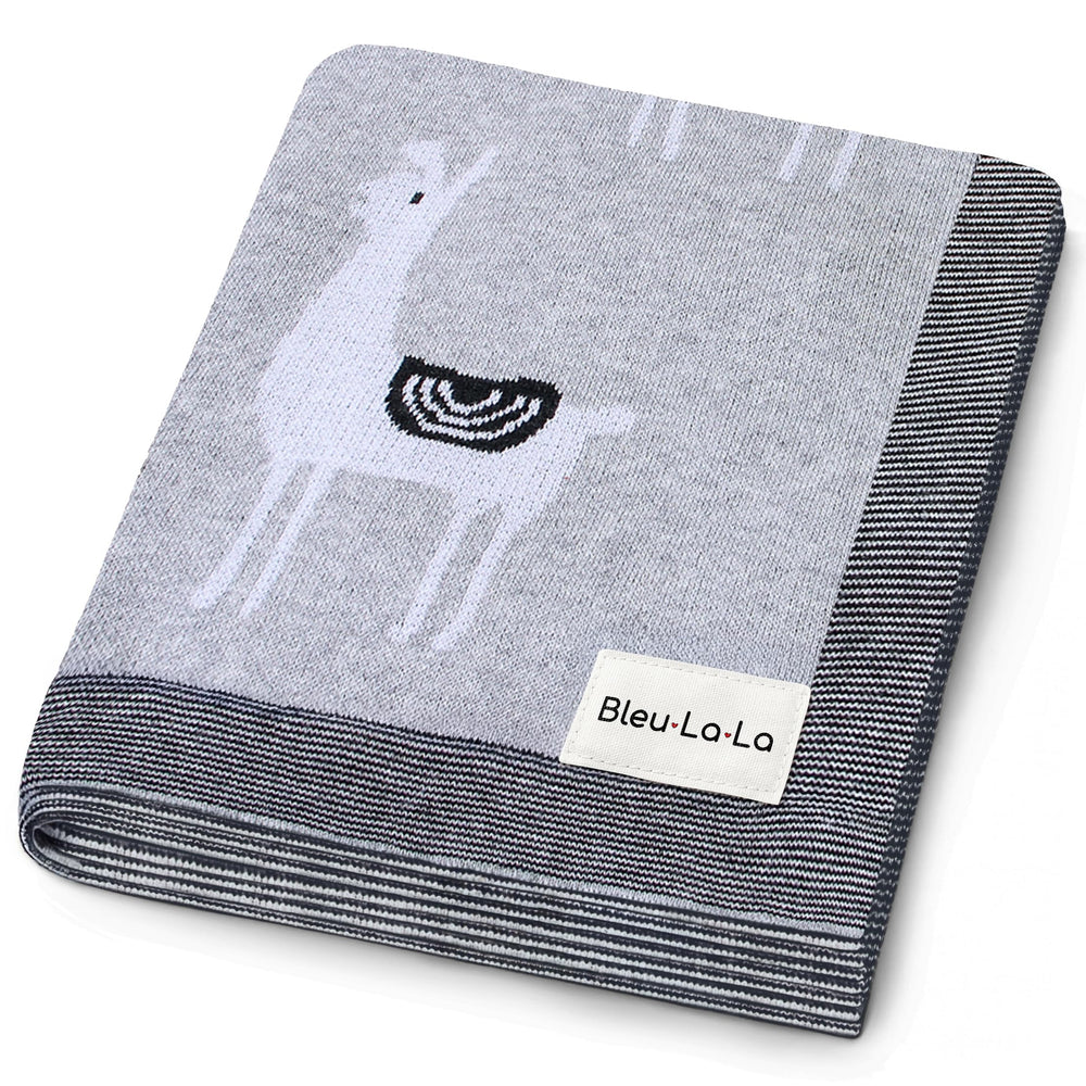 Bleu La La llama-pattern blanket provides cozy newborn warmth.