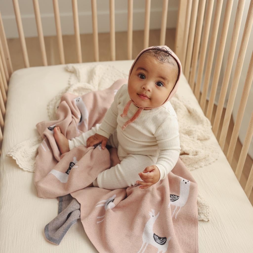 Bleu La La llama pink knit blanket wrapped for gifting and nursery decor.
