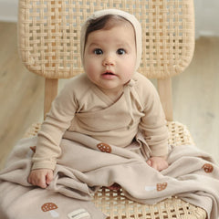 Bleu La La Mushroom Blue blanket on car seat demonstrates versatile travel comfort.