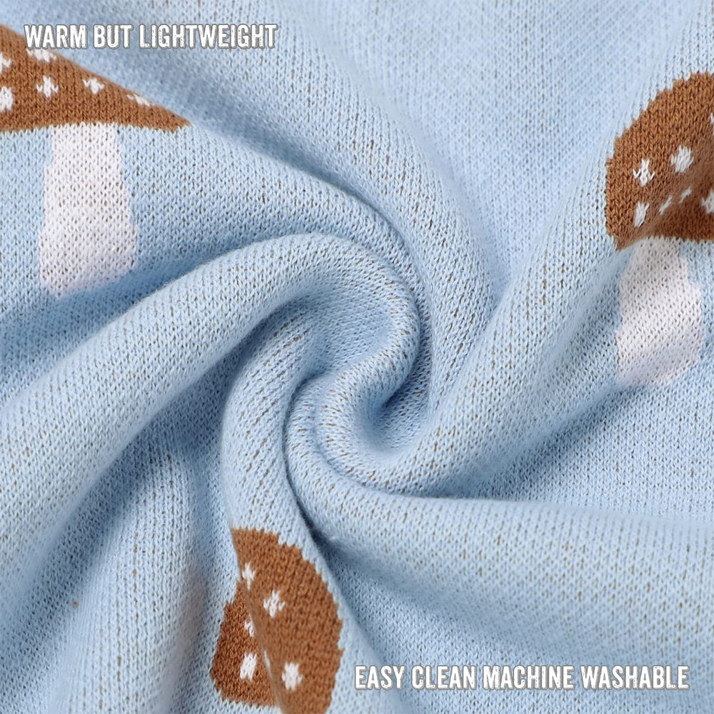 Bleu La La Mushroom Blue blanket folded on stroller for on-the-go coziness.