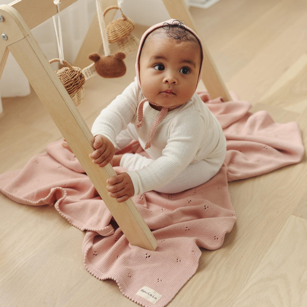 Bleu La La newborn swaddle-ready blanket supports daily cuddles.