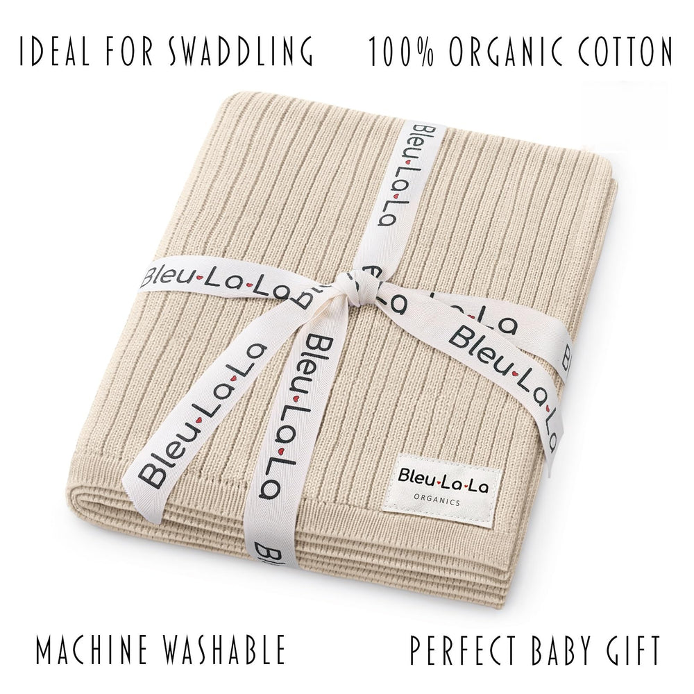 Bleu La La swaddle blanket in stroller setup, fits car seats during outings.
