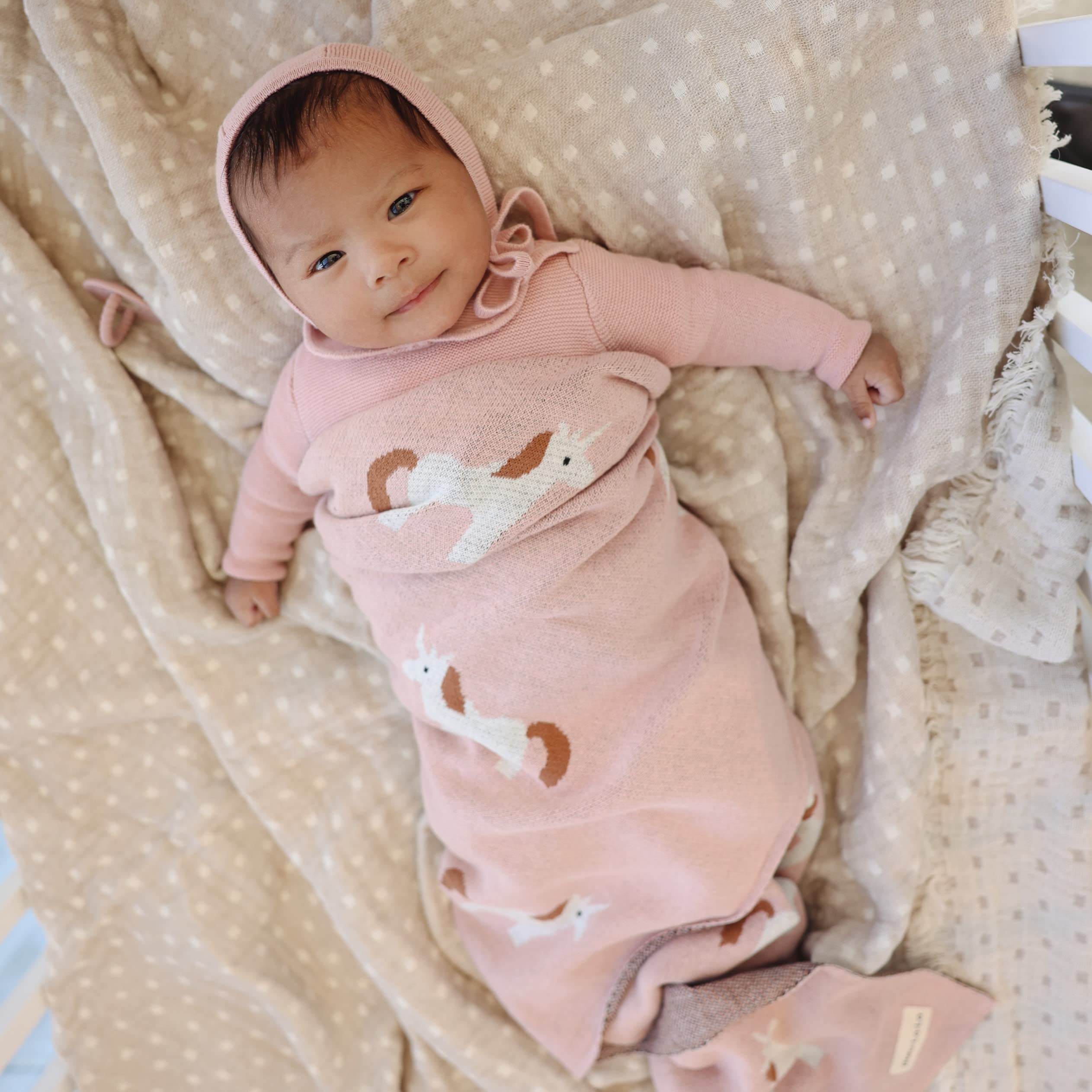 Bleu La La Unicorn Pink swaddle in nursery decor for versatile styling.