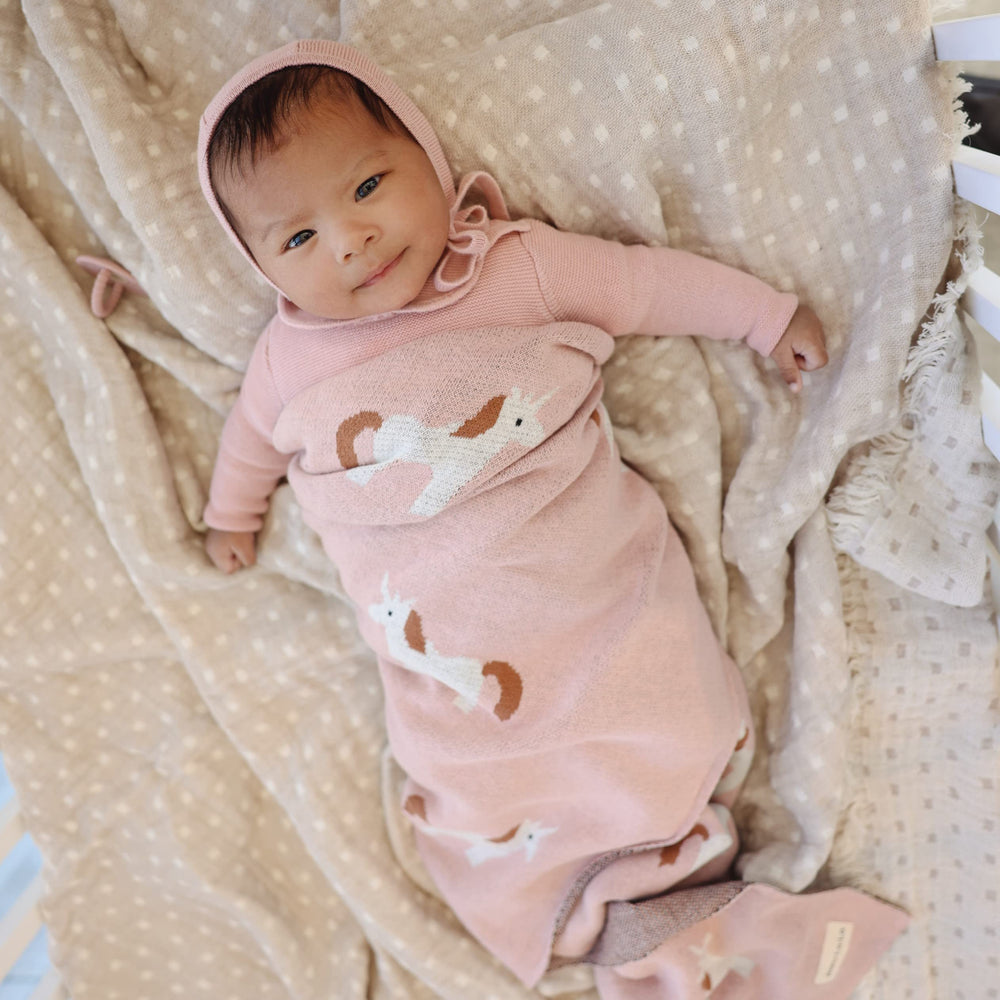 Bleu La La Unicorn Pink swaddle in nursery decor for versatile styling.