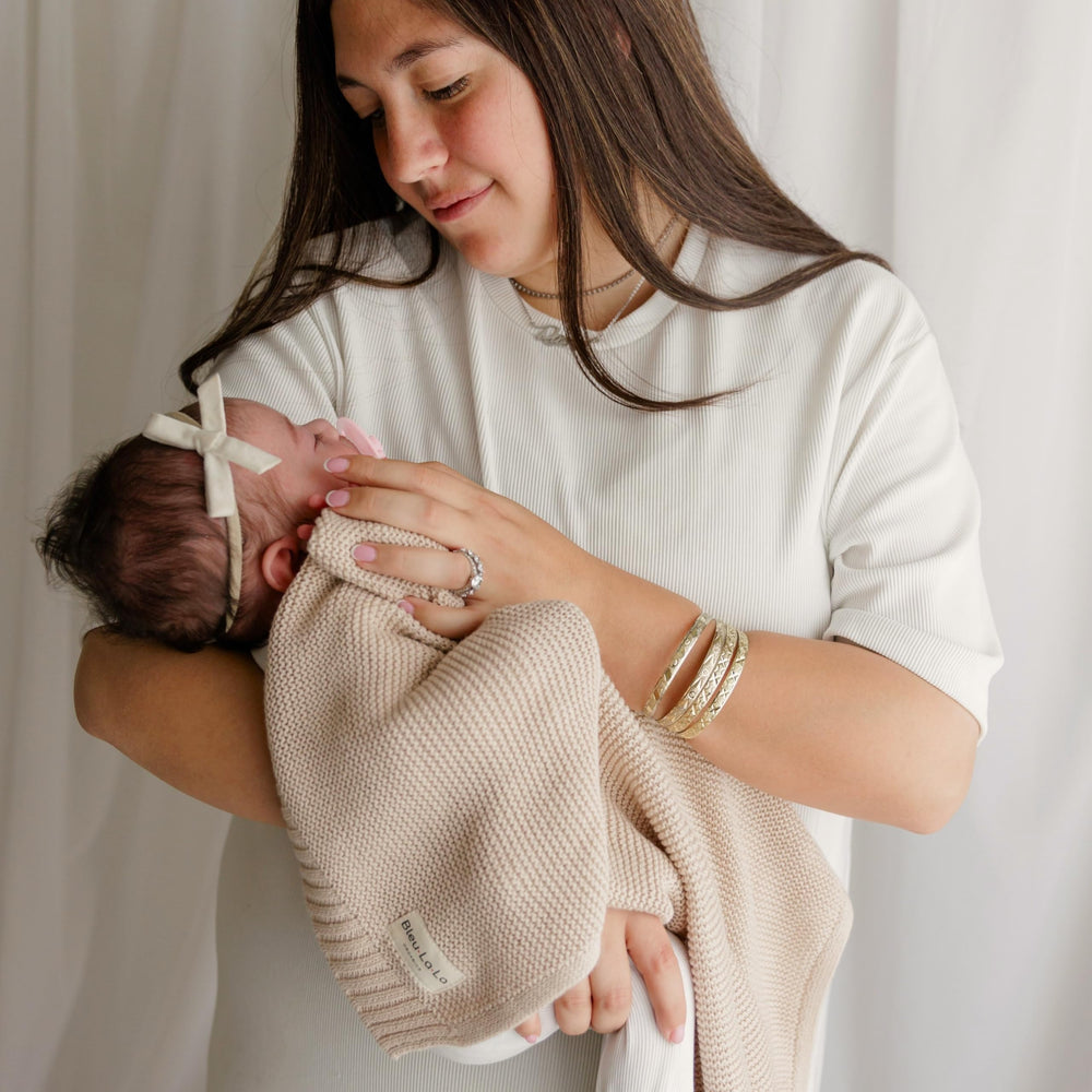 Bleu La La unisex oatmeal knit blanket complements any nursery decor.