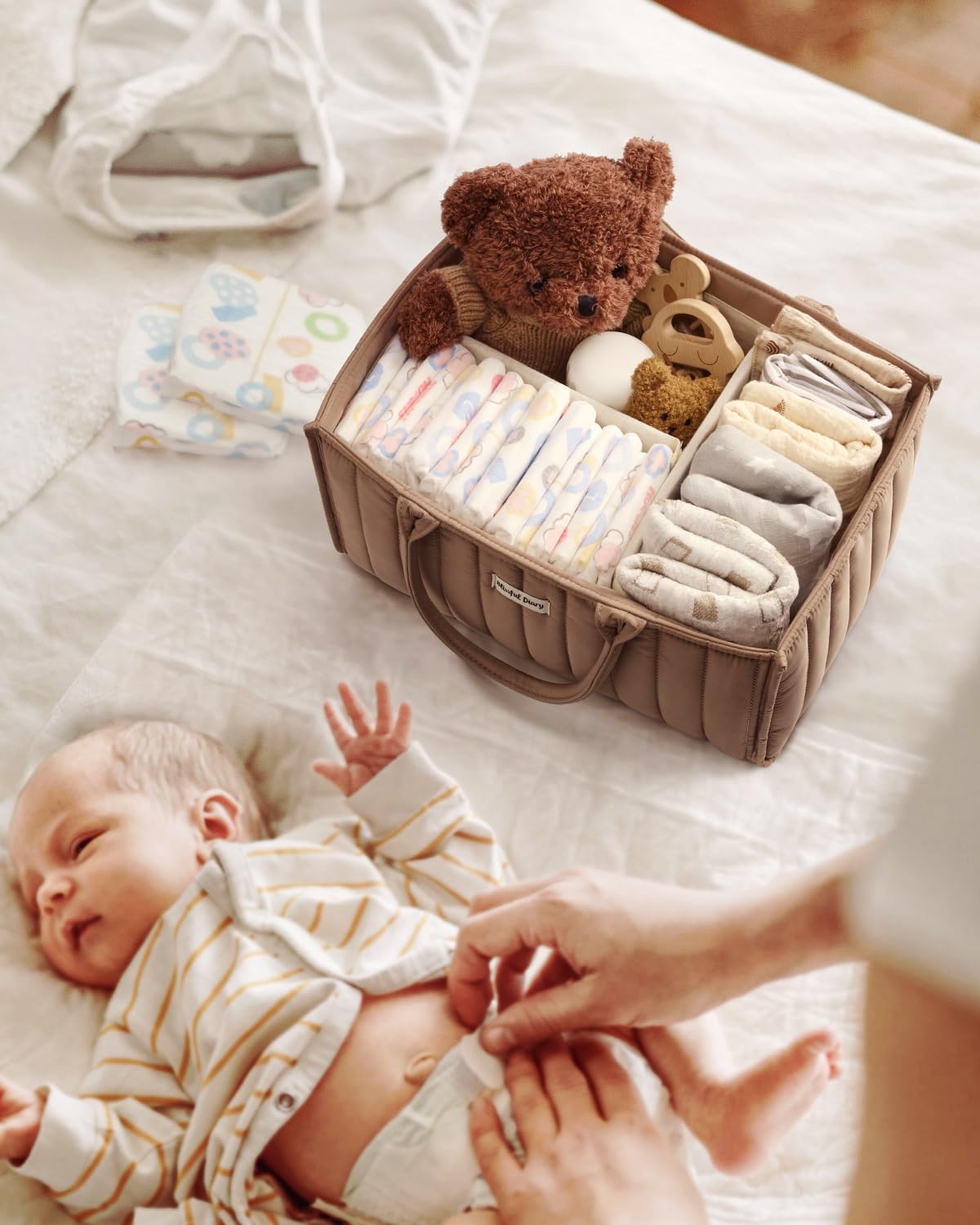 Blissful Diary mocha brown diaper caddy adds style to changing station.