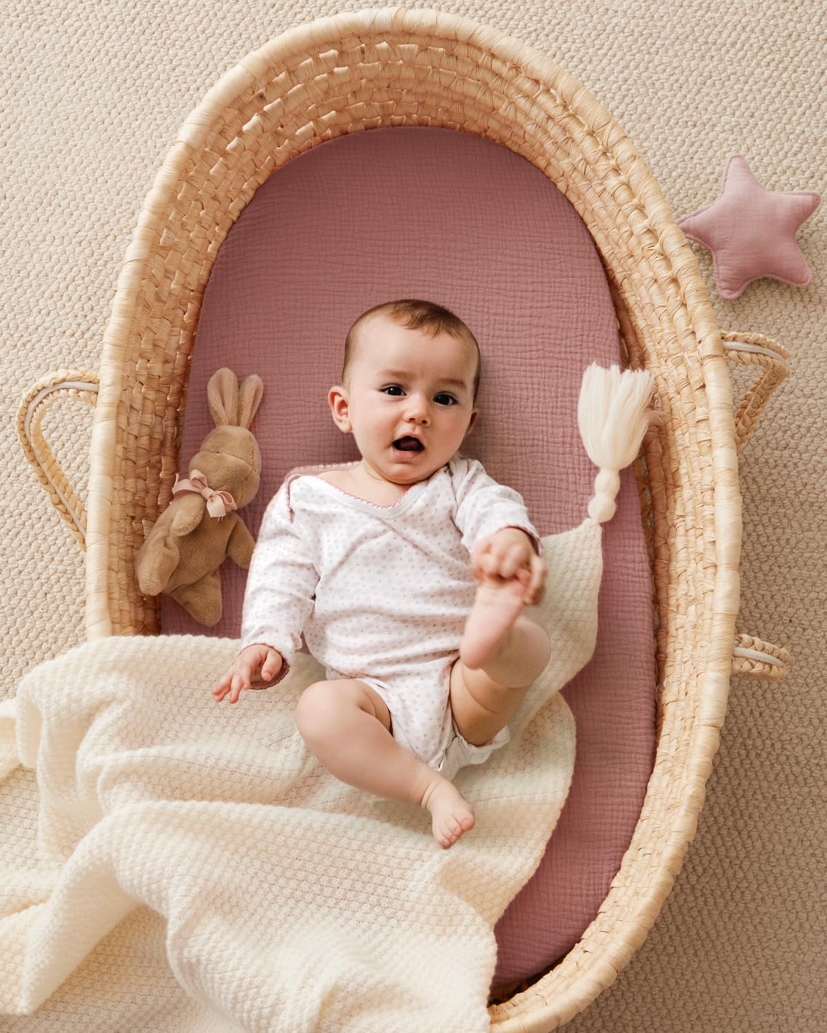 Blissful Diary bassinet sheet fits oval mattresses securely with elastic edge.