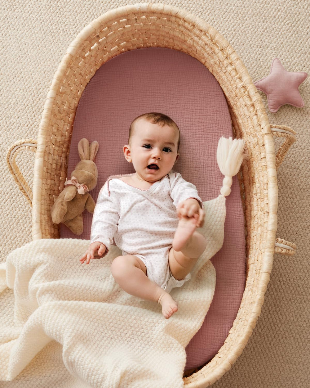 Blissful Diary bassinet sheet fits oval mattresses securely with elastic edge.