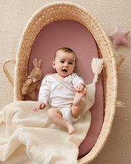 Blissful Diary bassinet sheet fits oval mattresses securely with elastic edge.