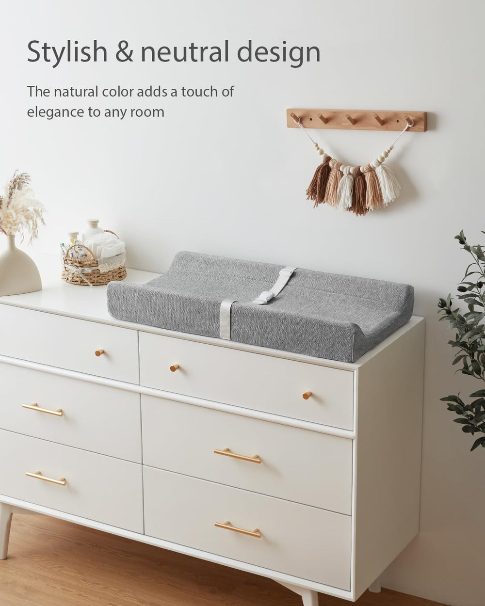 Blissful Diary changing pad placed on dresser top with secure belt