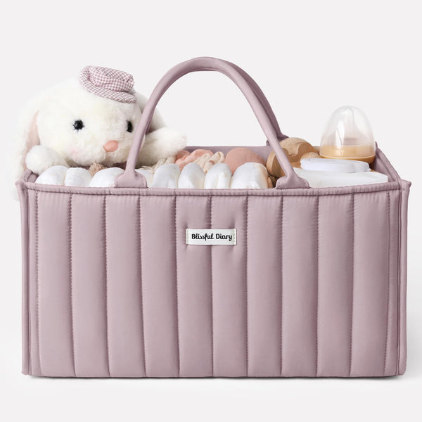 Blissful Diary diaper caddy with mauve pink handles for easy room-to-room transport.