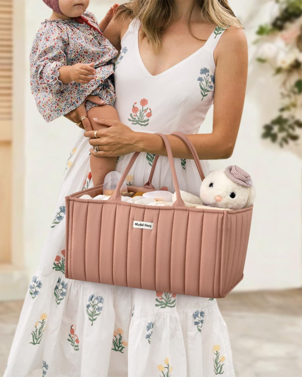 Blissful Diary multi-compartment diaper caddy keeps items separated for quick access.