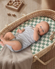 Blissful Diary bassinet sheet with elastic edge, snug fit for secure play.