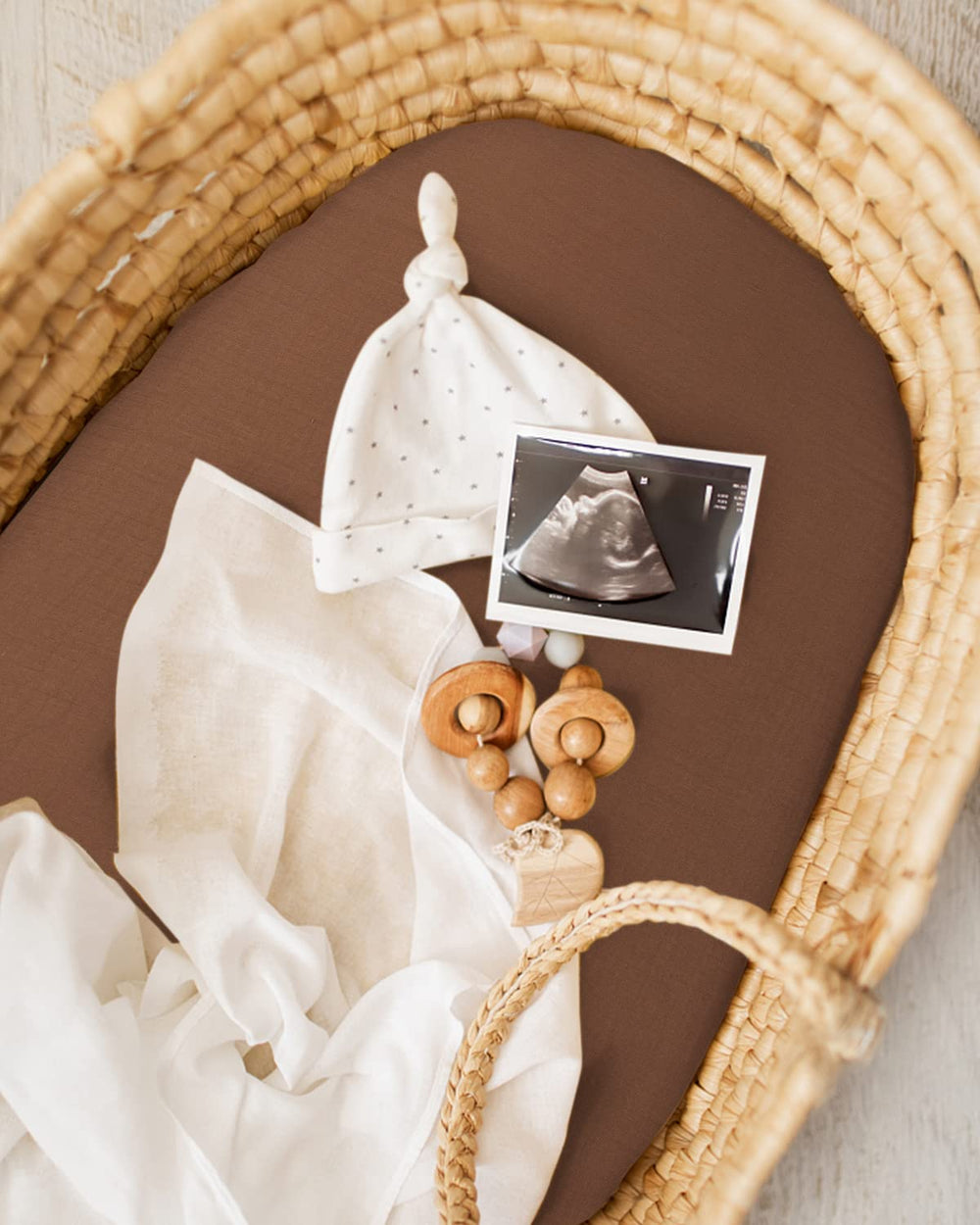 Elastic edge keeps Blissful Diary bassinet sheet secure during naps