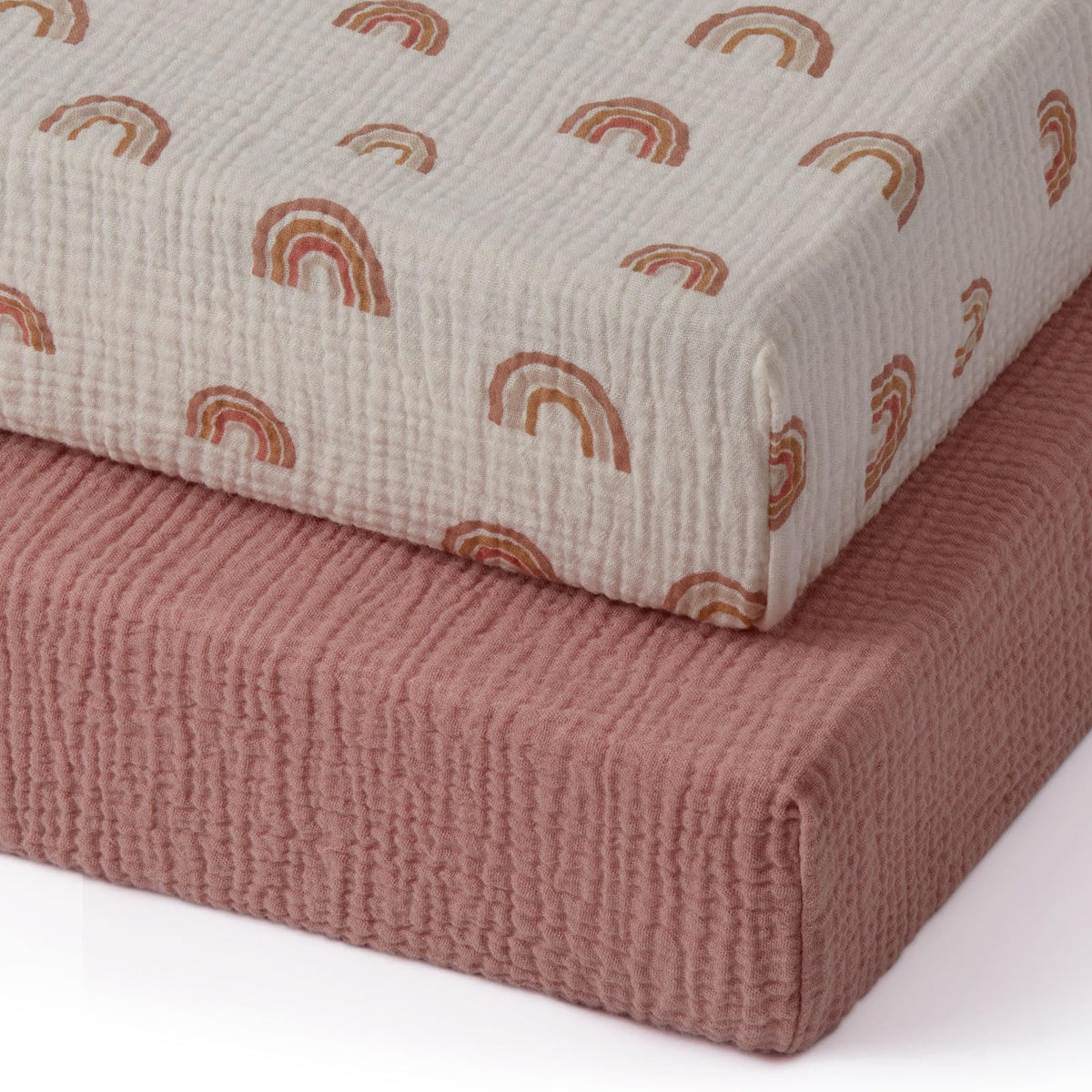 Blissful Diary muslin mini crib sheets in dusty pink with soft, breathable fabric for gentle sleep.
