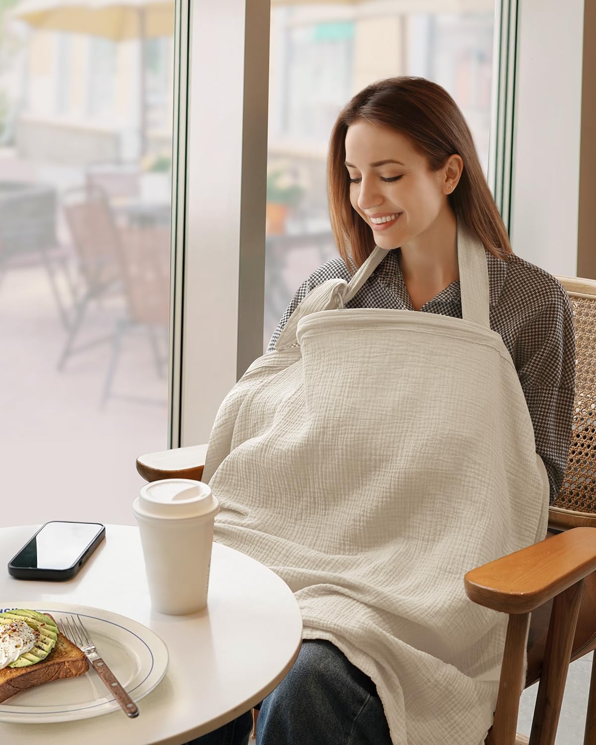 Blissful Diary cream nursing apron with adjustable straps stays secure during on-the-go feeds.
