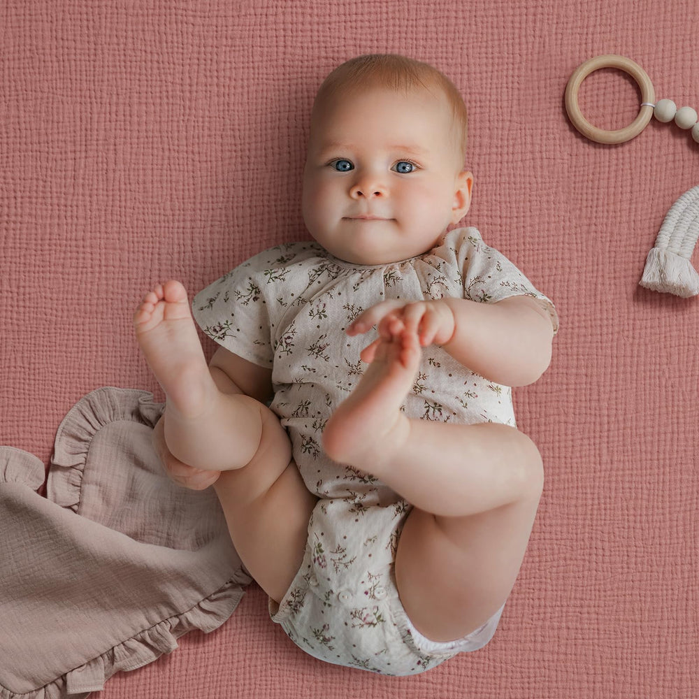 Blissful Diary pack-n-play sheet closeup shows elastic band for a secure, snug fit.