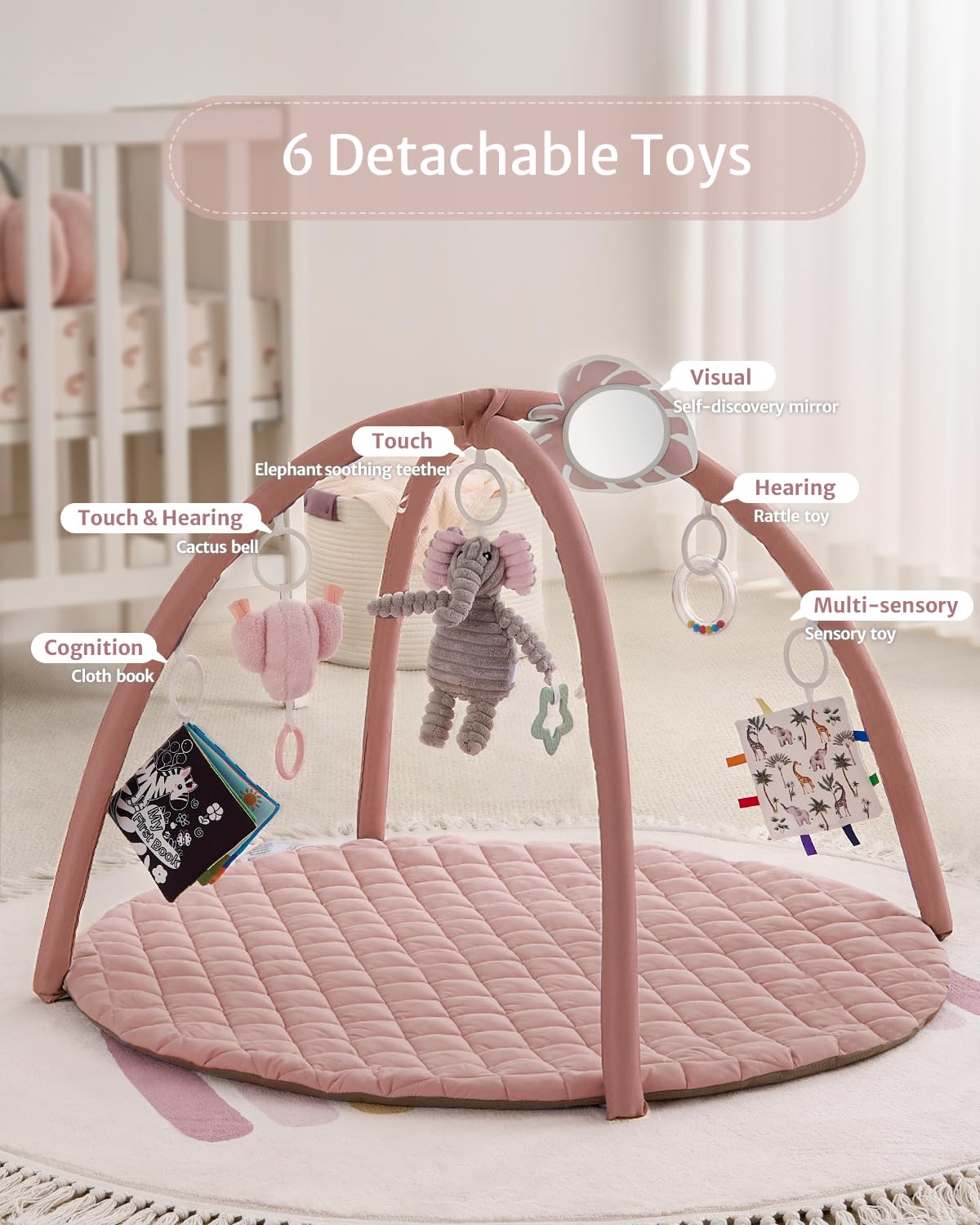 Rattle toy dangling from Blissful Diary gym arch to stimulate hearing and movement.