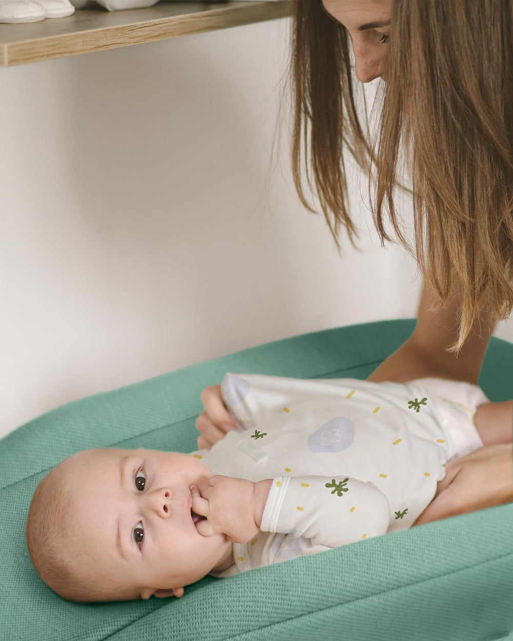 Nursery scene with Blissful Diary sage-green changing pad cover