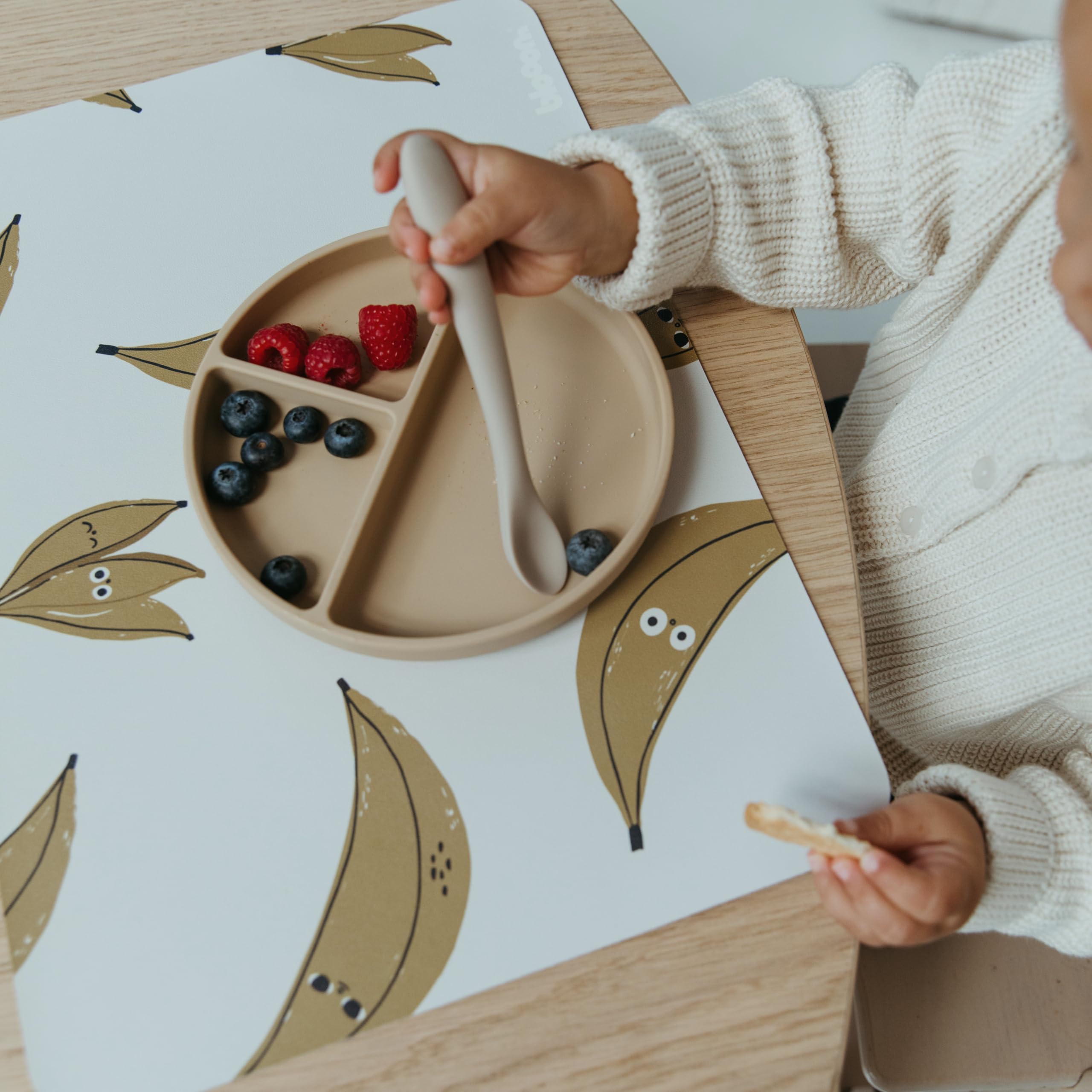 Blooom wipeable placemat demonstrates easy-clean surface for quick messes.